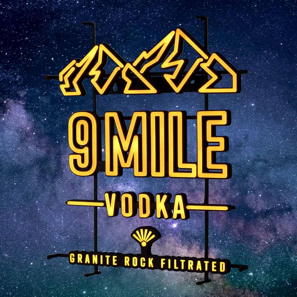 insegna luminosa LED Neon Sign 9 Mile Orange-Hills per interni, dimmerabile